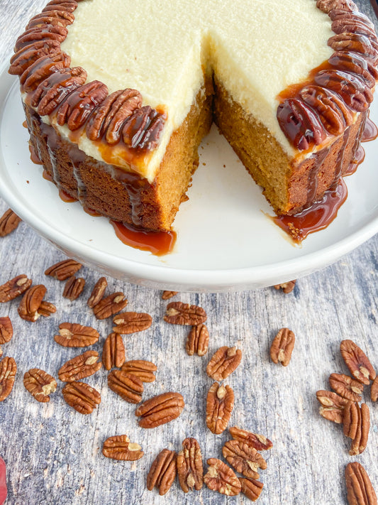 Delicious, moist, and full of pumpkin flavor! Topped with pecans and caramel sauce! This cake is sure to impress at any holiday gathering! 